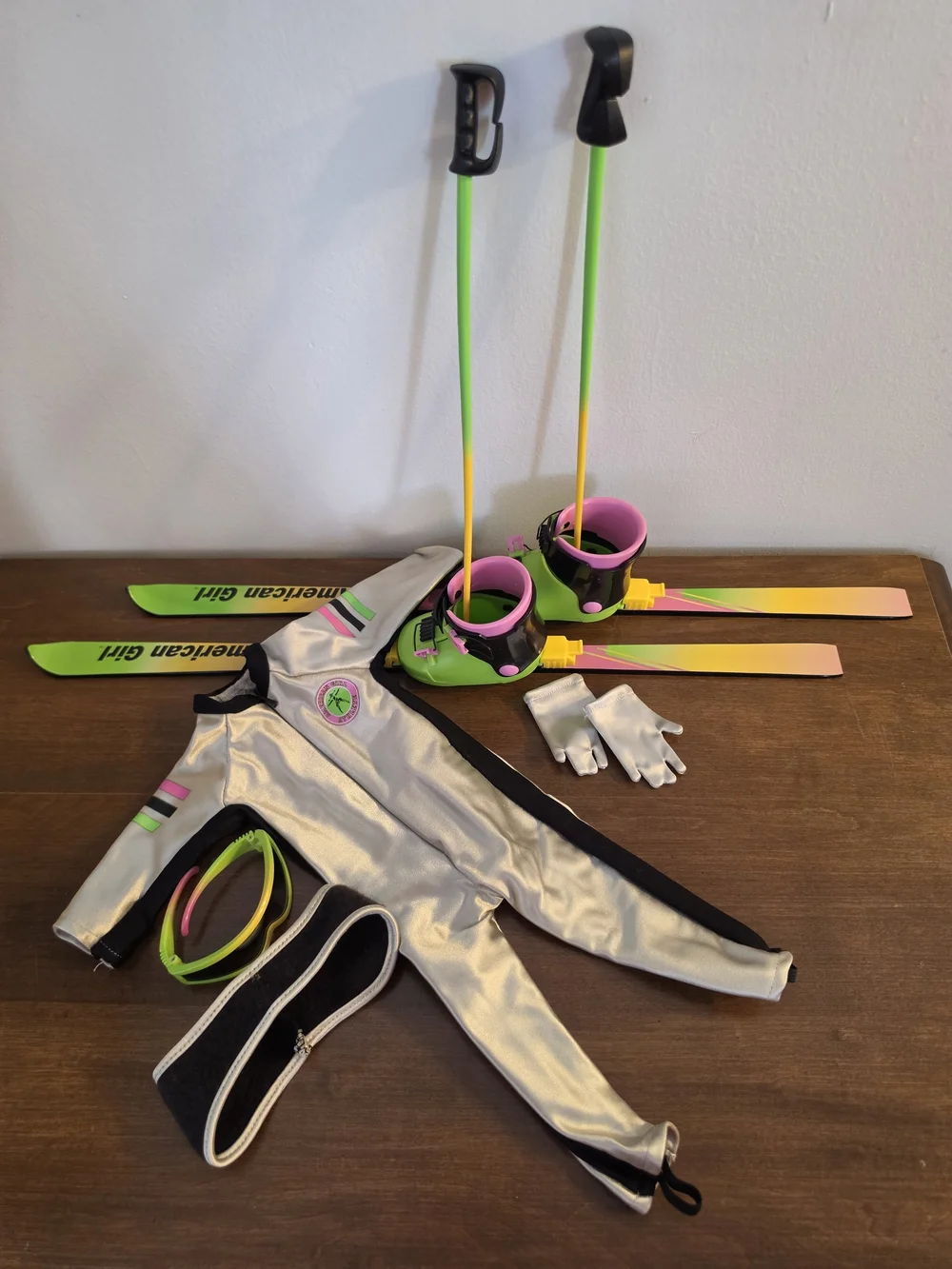 American Girl Silver Ski Suit with Neon Green and Pink Skis